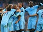 Fernandinho of Manchester City celebrartes with team mates after scoring the second goal during the Barclays Premier League match between Manchester City and Burnley at Etihad Stadium on December 28, 2014