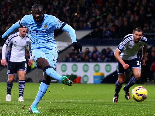 Yaya Toure of Manchester City scores his team's second goal from the penalty spot during the Barclays Premier League match between West Bromwich Albion and Manchester City at The Hawthorns on December 26, 2014