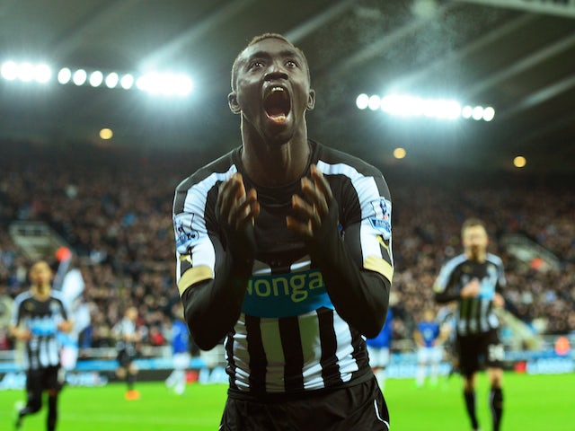 Papiss Demba Cisse of Newcastle United celebrates after scoring a goal to level the scores at 1-1 during the Barclays Premier League match against Everton on December 28, 2014