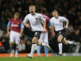 Manchester United player Paul Scholes wheels away after his goal during the Barclays Premiership match against Aston Villa on December 23, 2006