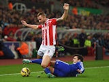 Phil Bardsley of Stoke City is tackled by Cesc Fabregas of Chelsea during the Barclays Premier League match on December 22, 2014