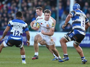 Sam Hill (C) of Exeter runs at Leroy Houston (R) and Kyle Eastmond (L) of Bath during the Aviva Premiership match on December 27, 2014
