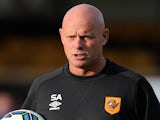 Steve Agnew, assistant manager of Hull City watches the warm up during a pre-season friendly between Harrogate Town and Hull City at the CNG Stadium on July 21, 2014
