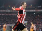 Adam Johnson of Sunderland celebrates after scoring the opening goal during the Barclays Premier League match between Sunderland and Hull City at the Stadium of Light on December 26, 2014