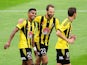 Roy Krishna of the Phoenix is congratulated on his goal by teammates Andrew Durante and Nathan Burns during the round 13 A-League match between the Wellington Phoenix and the Western Sydney Wanderers at Westpac Stadium on December 28, 2014