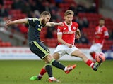Adam Clayton of Middlesbrough clears the ball from Luke Berry of Barnsley during the FA Cup Third Round match on January 3, 2015