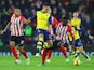 Alex Oxlade-Chamberlain of Arsenal takes on Victor Wanyama and Ryan Bertrand of Southampton during the Barclays Premier League match between Southampton and Arsenal at St Mary's Stadium on January 1, 2015