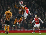 Hull City's Ivorian striker Yannick Sagbo vies with Arsenals French midfielder Francis Coquelin during the English FA Cup third round football match between Arsenal and Hull City at the Emirates Stadium in London on January 4, 2015