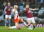 Joe Cole of Aston Villa is tackled by David Perkins of Blackpool during the FA Cup Third Round match between Aston Villa and Blackpool at Villa Park on January 4, 2015