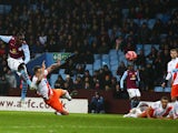 Christian Benteke of Aston Villa scores the opening goal during the FA Cup Third Round match between Aston Villa and Blackpool at Villa Park on January 4, 2015