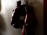 oxing gloves hang on the wall at the Urbina Westside Boxing Gym where Israel Vasquez Two-time Junior Featherweight World Champion had a workout session on September 29, 2009 i