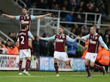 Burnley's Scottish midfielder George Boyd celebrates scoring their third goal with Burnley's English defender Kieran Trippier and teammates during the English Premier League football match between Newcastle United and Burnley at St James' Park in Newcastl