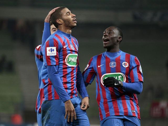 Caen's French midfielder Jordan Adeoti celebrates with teammates after scoring during the French Cup round of 64 football match between Caen and Dijon at the Michel d'Ornano stadium in Caen, northwestern France, on January 4, 2015