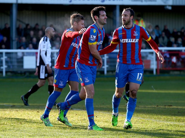 Scott Dann of Crystal Palace celebrates his second goal during to the FA Cup third round match between Dover Athletic and Crystal Palace at the Crabble Athletic ground on January 4, 2015