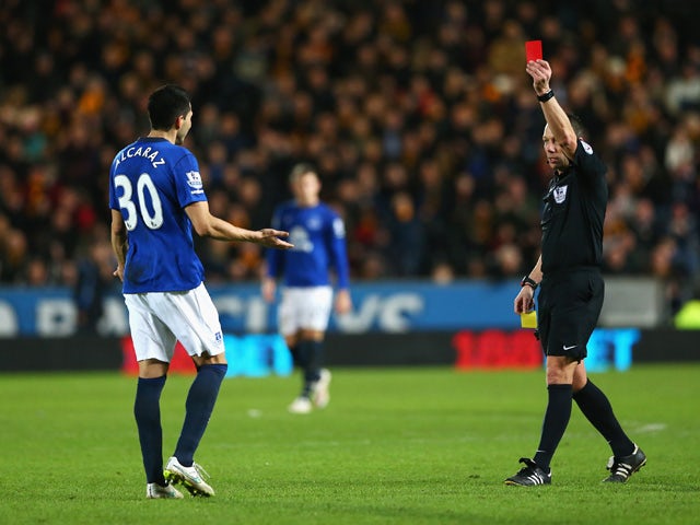 Antolin Alcaraz of Everton is shown the red card by referee Kevin Friend during the Barclays Premier League match between Hull City and Everton at KC Stadium on January 1, 2015