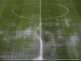 A detailed view of the waterlogged pitch after play is suspended due to bad weather during the UEFA EURO 2012 group D match between Ukraine and France at Donbass Arena on June 15, 2012
