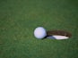 A general view of a golf ball sitting near a hole for the Michelob Championships at the Kingsmill Golf Course in Williamsburg