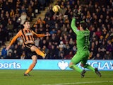 Nikica Jelavic of Hull City touches the ball over Joel Robles of Everton for his team's second goal during the Barclays Premier League match between Hull City and Everton at KC Stadium on January 1, 2015