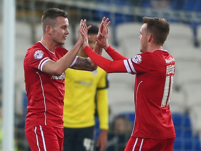 Joe Ralls (C) of Cardiff celebrates with Craig Noone (R) after scoring the opening goal during the FA Cup Third Round match against Colchester United on December 2, 2014