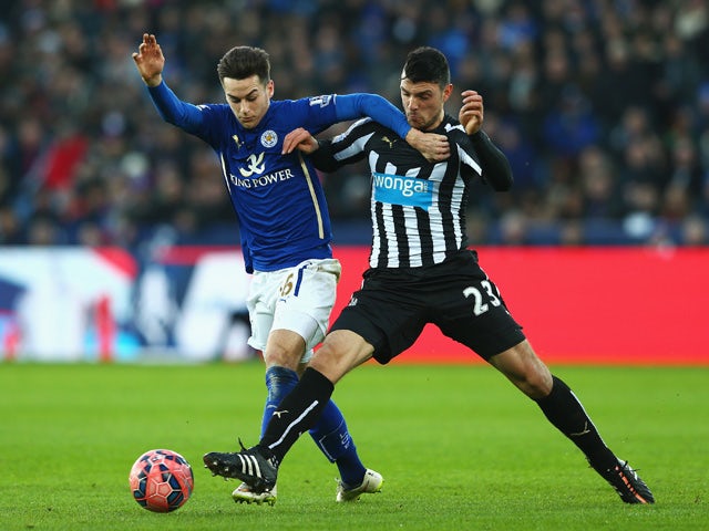 Tom Lawrence of Leicester City is challenged by Haris Vuckic of Newcastle United during the FA Cup Third Round match between Leicester City and Newcastle United at The King Power Stadium on January 3, 2015