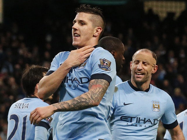 Manchester City's Montenegrin striker Stevan Jovetic celebrates scoring their second goal during the English Premier League football match between Manchester City and Sunderland at the Etihad Stadium in Manchester, north west England, on January 1, 2015