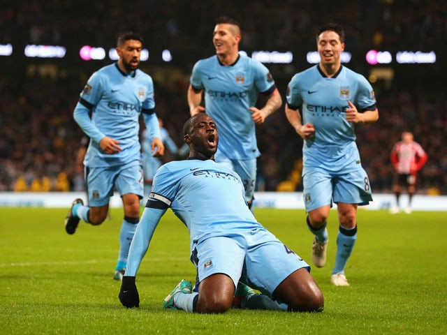 Yaya Toure of Manchester City celebrates the opening goal during the Barclays Premier League match between Manchester City and Sunderland at Etihad Stadium on January 1, 2015