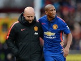 Manchester United's English midfielder Ashley Young is helped off the pitch after sustaining an injury during the English Premier League football match between Stoke City and Manchester United at the Britannia Stadium in Stoke-on-Trent, central England, o