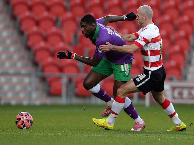Paul Keegan (R) of Doncaster Rovers challenges Jay Emmanuel-Thomas of Bristol City during the FA Cup Third Round match on January 3, 2015