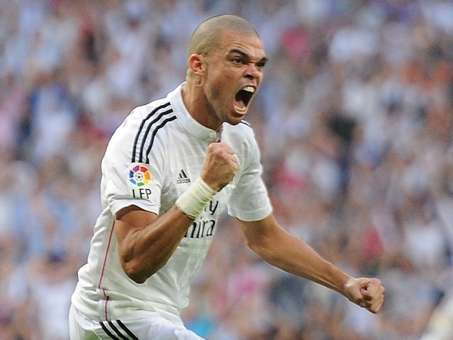 Pepe of Real Madrid CF celebrates after scoring his team's 2nd goal from the penalty spot during the La Liga match against FC Barcelona on October 25, 2014