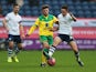 Josh Brownhill of Preston North End battles with Gary Hooper of Norwich City during the FA Cup Third Round match between Preston North End and Norwich City at Deepdale on January 3, 2015