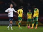 Despair for Norwich City players as Paul Gallagher of Preston North End (L) celebrates scoring their first goal during the FA Cup Third Round match between Preston North End and Norwich City at Deepdale on January 3, 2015