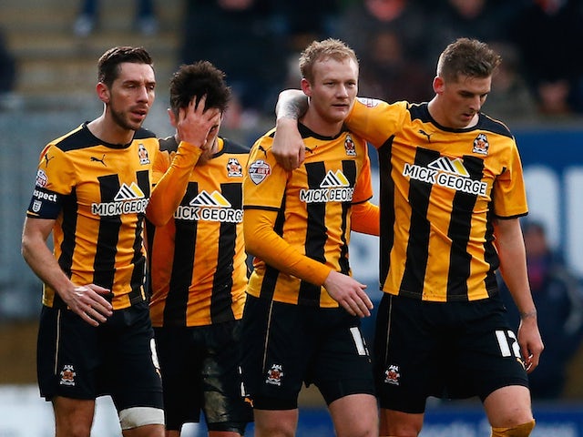 Robbie Simpson of Cambridge is congratulated by team mates after scoring to make it 1-0 during the FA Cup Third Round match between Cambridge United and Luton on January 3, 2015