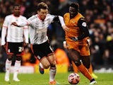 Scott Parker of Fulham challenges Bakary Sako of Wolverhampton Wanderers during the FA Cup Third Round match on January 3, 2015