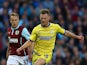 Tom Lees of Sheffield Wednesday in action with Scott Arfield of Burnley during the Capital One Cup Second Round match between Burnley and Sheffield Wednesday at Turf Moor on August 26, 2014