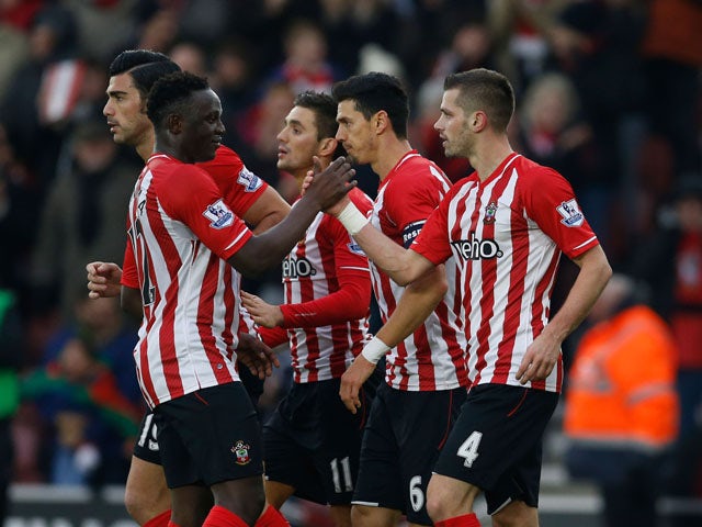 Morgan Schneiderlin #4 of Southampton celebrates with teammates after scoring a goal to level the scores at 1-1 during the FA Cup Third Round match between Southampton and Ipswich Town at St Mary's Stadium on January 4, 2015