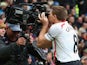 Steven Gerrard of Liverpool celebrates scoring the second goal by kissing the steadicam during the Barclays Premier League match against Manchester United at Old Trafford on March 16, 2014