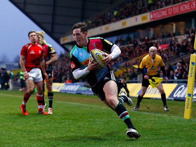 Tom Williams of Harlequins crosses the line to score the final try during the Aviva Premiership match between London Welsh and Harlequins at the Kassam Stadium on January 4, 2015