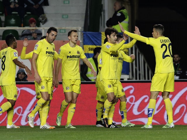 Villarreal players celebrate their first goal during the Spanish league football match Elche FC vs Villarreal CFat the Martinez Valero stadium in Elche on January 3, 2015