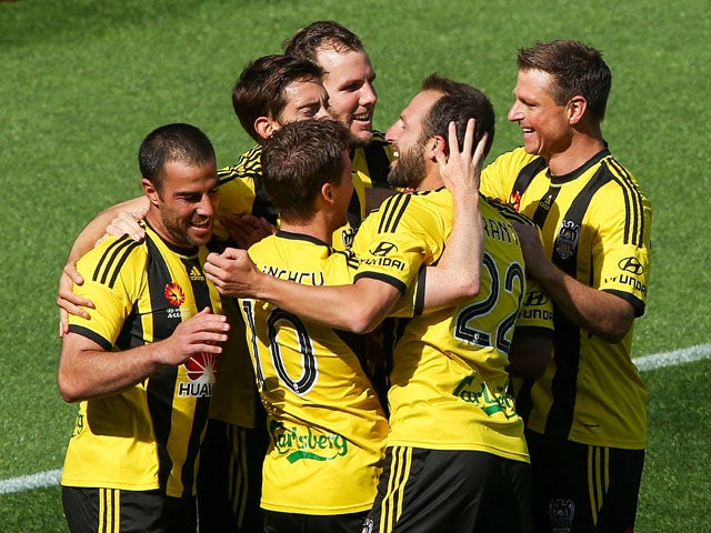 Manny Muscat of the Phoenix is congratulted on his goal by teammates during the round 15 A-League match between the Wellington Phoenix and Brisbane Roar at Westpac Stadium on January 4, 2015 