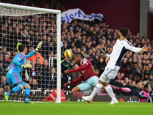 Diafra Sakho of West Ham United (C) heads the ball past goalkeeper Ben Foster of West Bromwich Albion to score their first goal during the Barclays Premier League match between West Ham United and West Bromwich Albion at Boleyn Ground on January 1, 2015