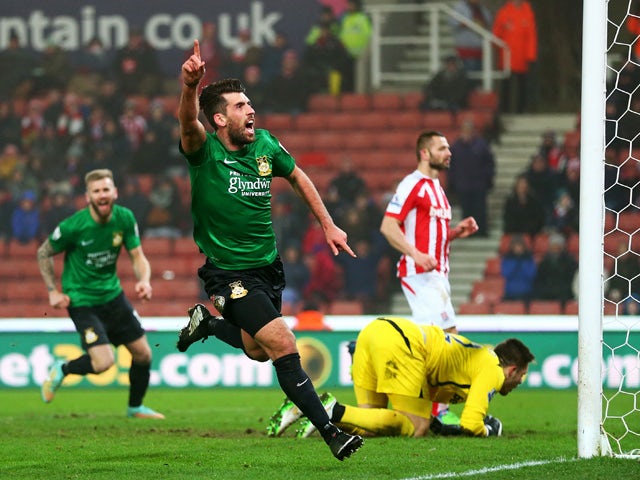 Mark Carrington of Wrexham celebrates after scoring the opening goal during the FA Cup Third Round match between Stoke City and Wrexham at Britannia Stadium on January 4, 2015
