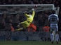 The ball goes beyond Yeovil Town's English goalkeeper Jed Steer as he dives but fails to save the shot from Manchester United's Spanish midfielder Ander Herrera for the opening goal during the English FA Cup third round football match between Yeovil Town 