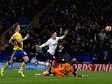 Zach Clough (C) of Bolton scores the opening goal during the FA Cup Third Round match between Bolton Wanderers and Wigan Athletic at the Macron Stadium on January 3, 2015