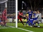 Adebayo Akinfenwa of AFC Wimbledon pokes the ball into the net to score a goal and level the scores at 1-1 during the FA Cup Third Round match between AFC Wimbledon and Liverpool at The Cherry Red Records Stadium on January 5, 2015