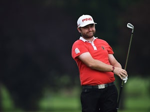 Sullivan leads as play suspended in Abu Dhabi