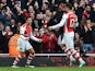 Arsenal's Chilean striker Alexis Sanchez celebrates with Arsenal's French striker Olivier Giroud after scoring their second goal during the English Premier League football match between Arsenal and Stoke City at the Emirates Stadium in London on January 1