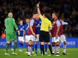 Ciaran Clark of Aston Villa reacts as he is shown the red card by referee Michael Oliver during the Barclays Premier League match between Leicester City and Aston Villa at The King Power Stadium on January 10, 2015