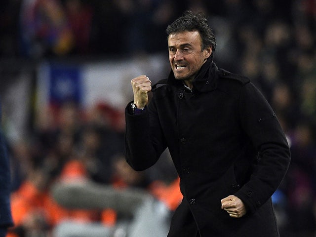 Barcelona's coach Luis Enrique celebrates after a goal during the Spanish league football match FC Barcelona vs Club Atletico de Madrid at the Camp Nou stadium in Barcelona on January 11, 2015