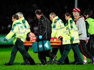 Ben Morgan of Gloucester is stretchered off with an injury during the Aviva Premiership match between Gloucester Rugby and Saracens at Kingsholm Stadium on January 9, 2015