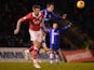 Brennan Dickenson of Gillingham battles with Aden Flint of Bristol City during the Johnstone's Paint Southern Area Final first leg, on January 6, 2015